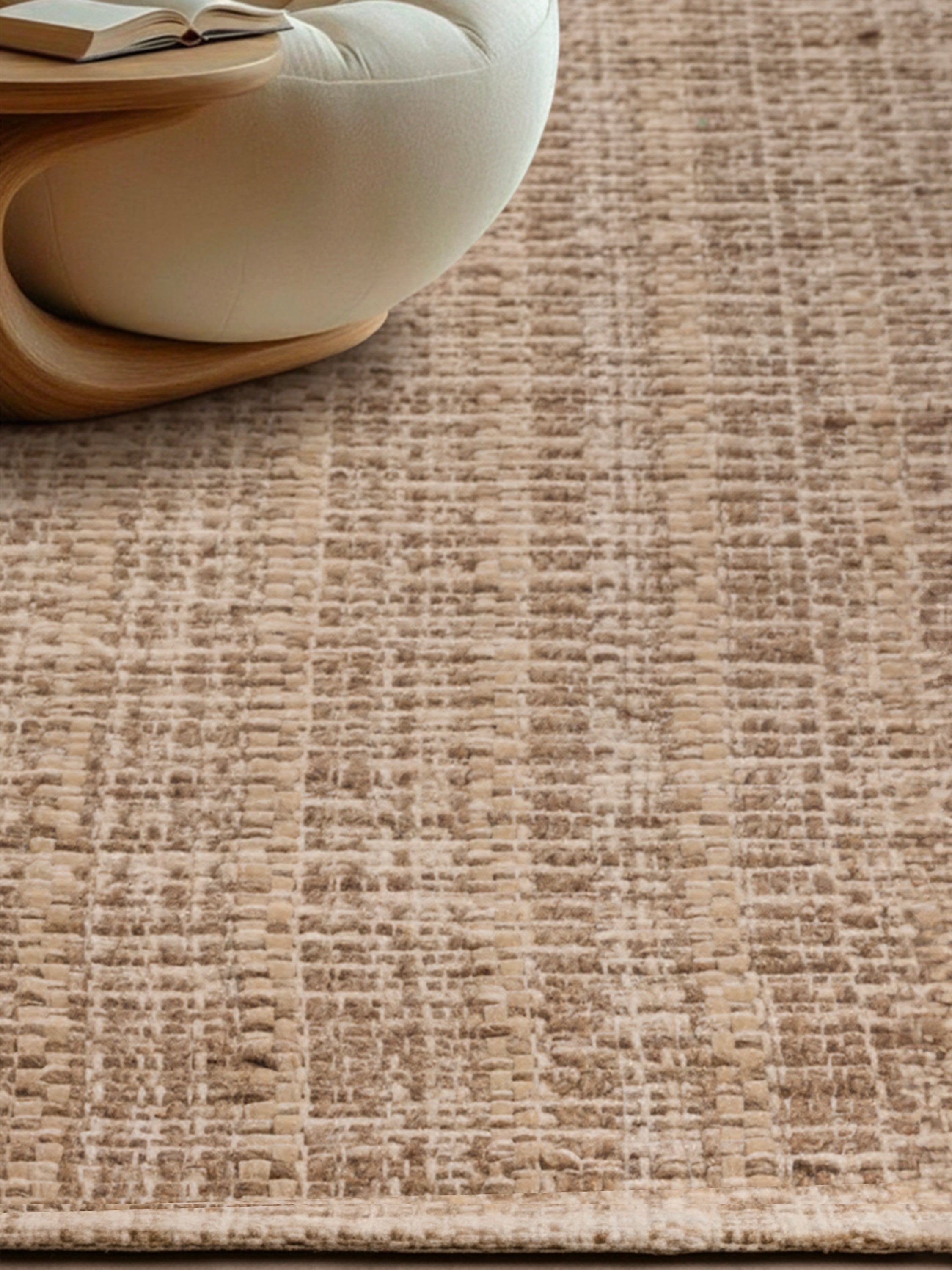 Phoenix flatweave rug styled in a neutral interior showcasing its serene, organic design
