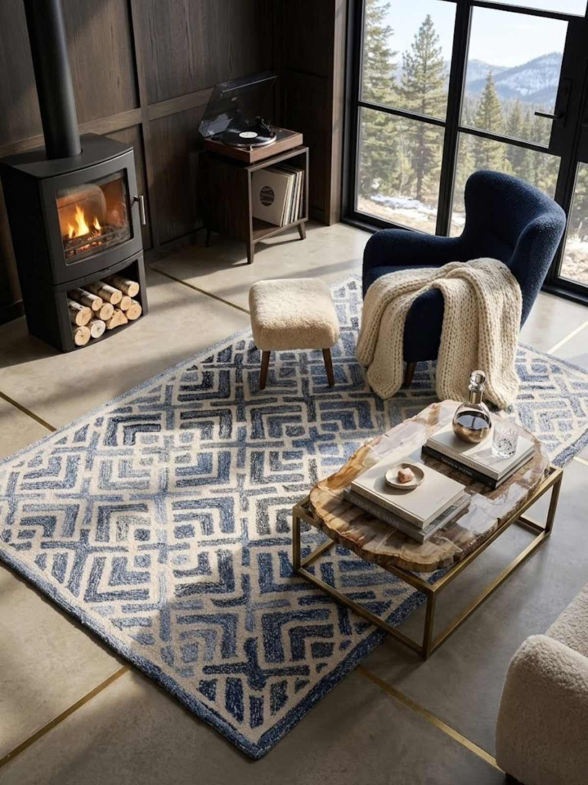 Wool and denim rug with an angular geometric pattern, styled in a living room.