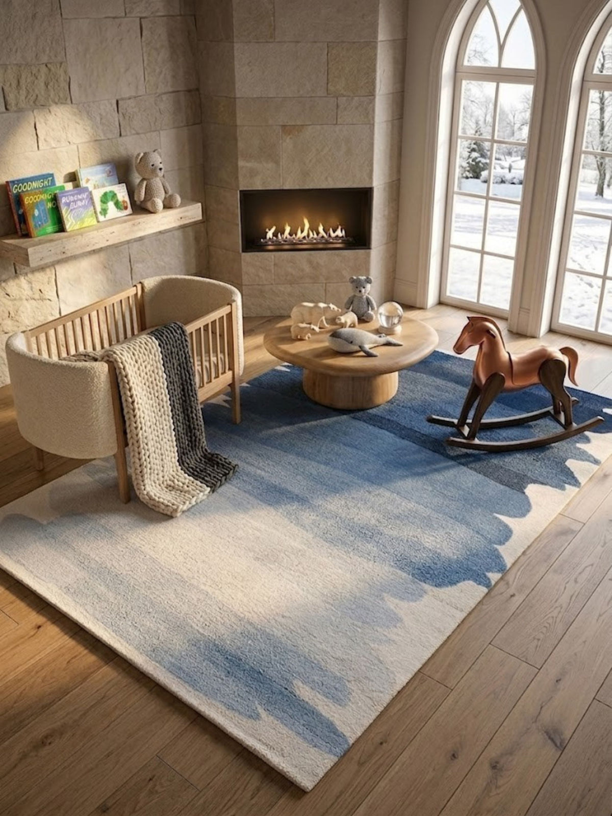 Navy-to-ivory wool rug, dense tufted pile, placed in a nursery beside a crib and rocking horse.
