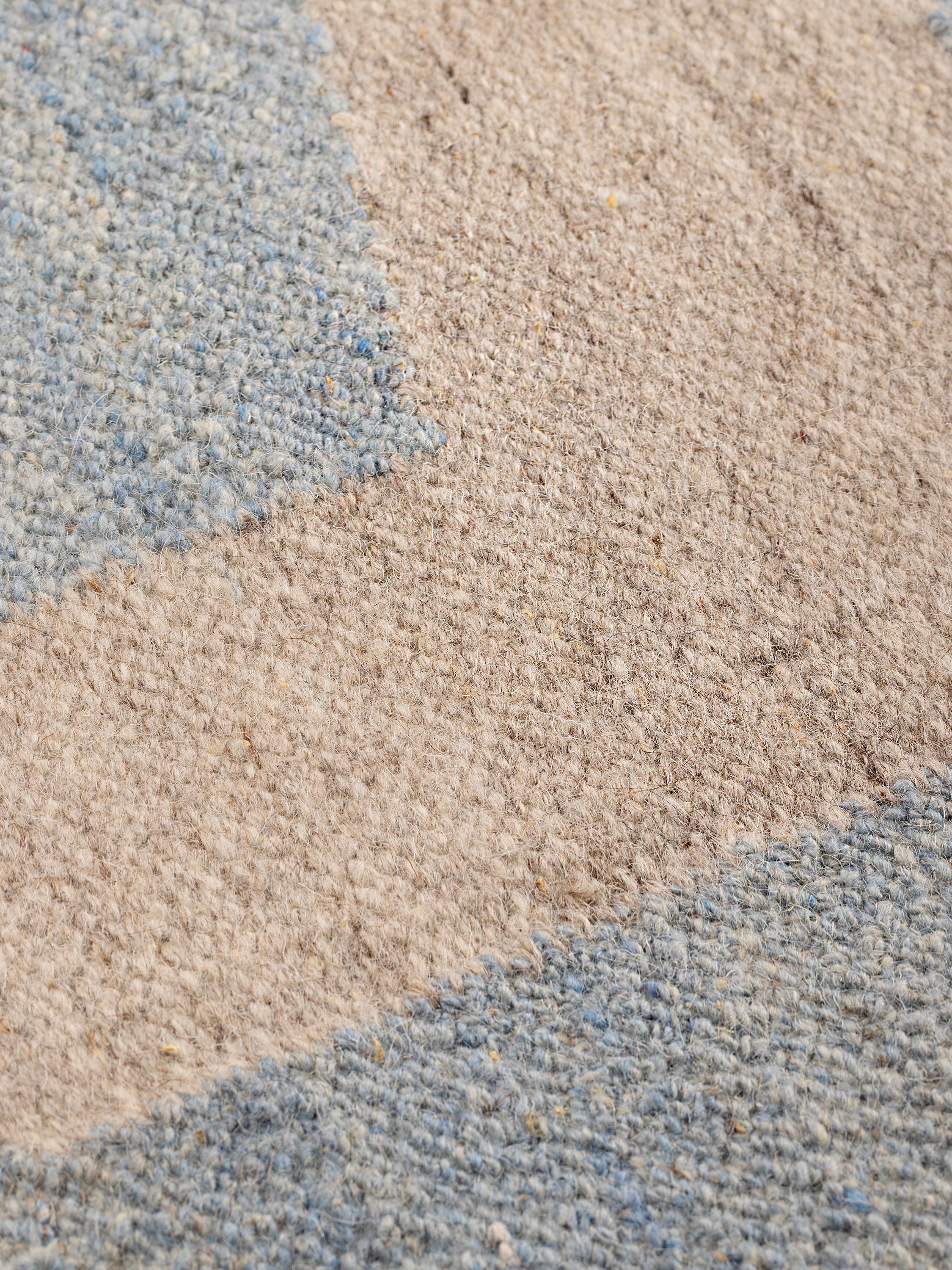 Close-up of Simona Rug’s flatweave wool texture in ocean hues