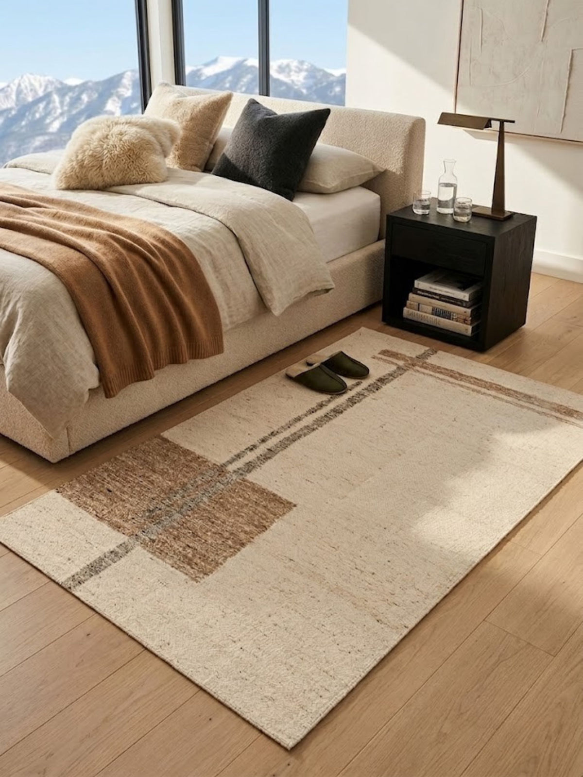 Wool rug with a caramel block pattern, styled beside a bedroom nightstand.