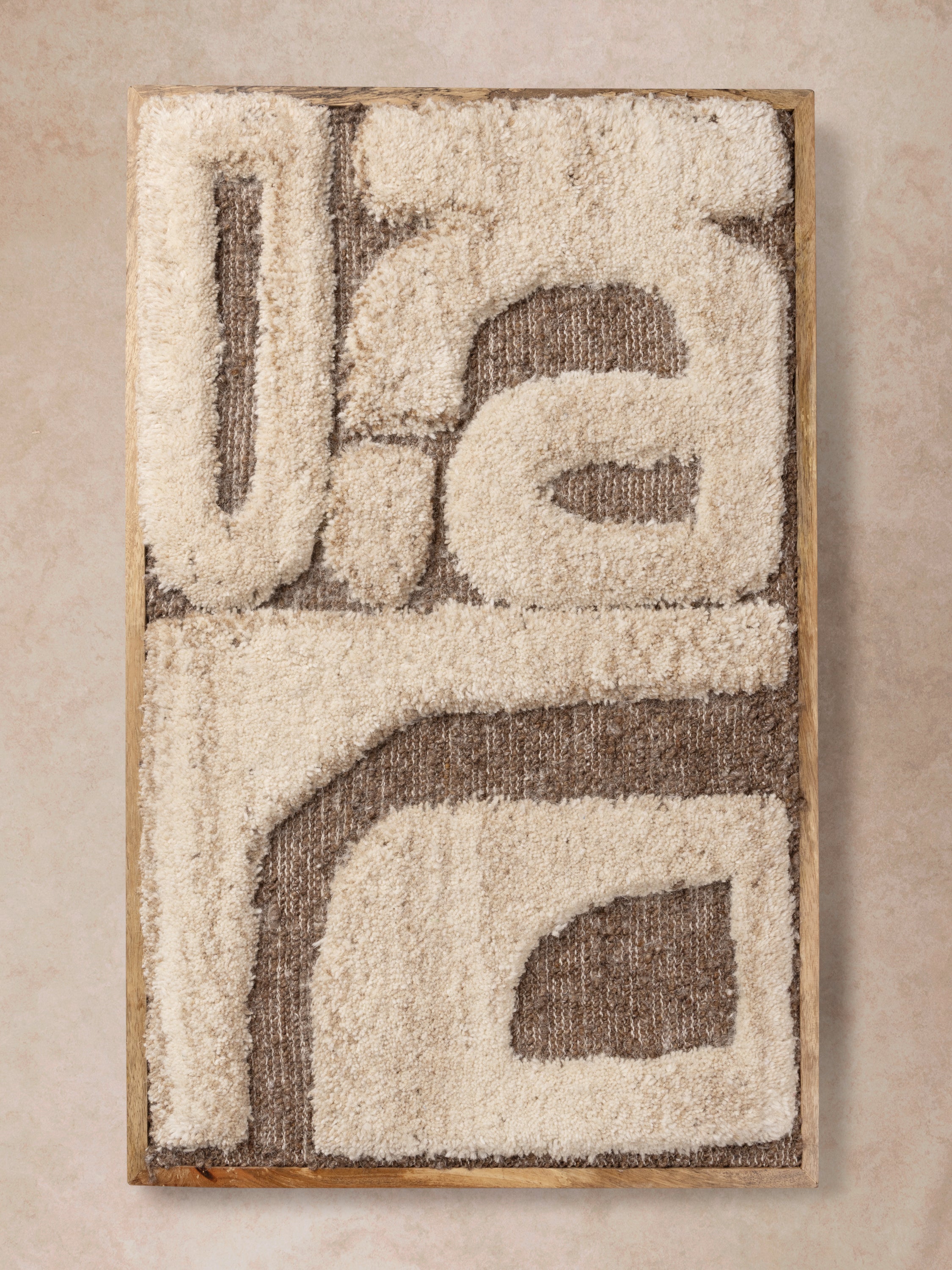 handwoven Congo wall art with raised ivory tufting over brown woven base