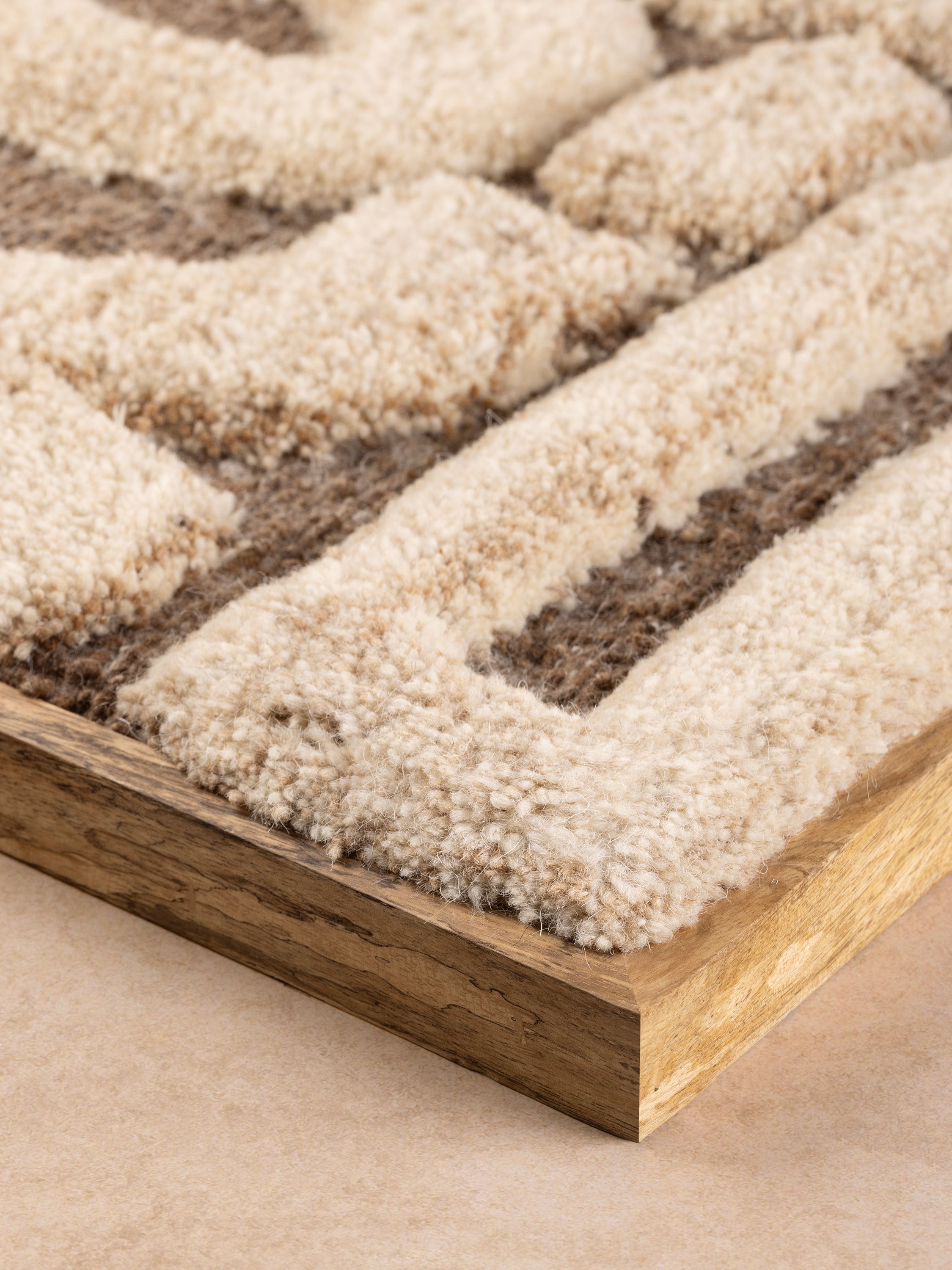 sculptural wool tufting detail showing dimensional texture