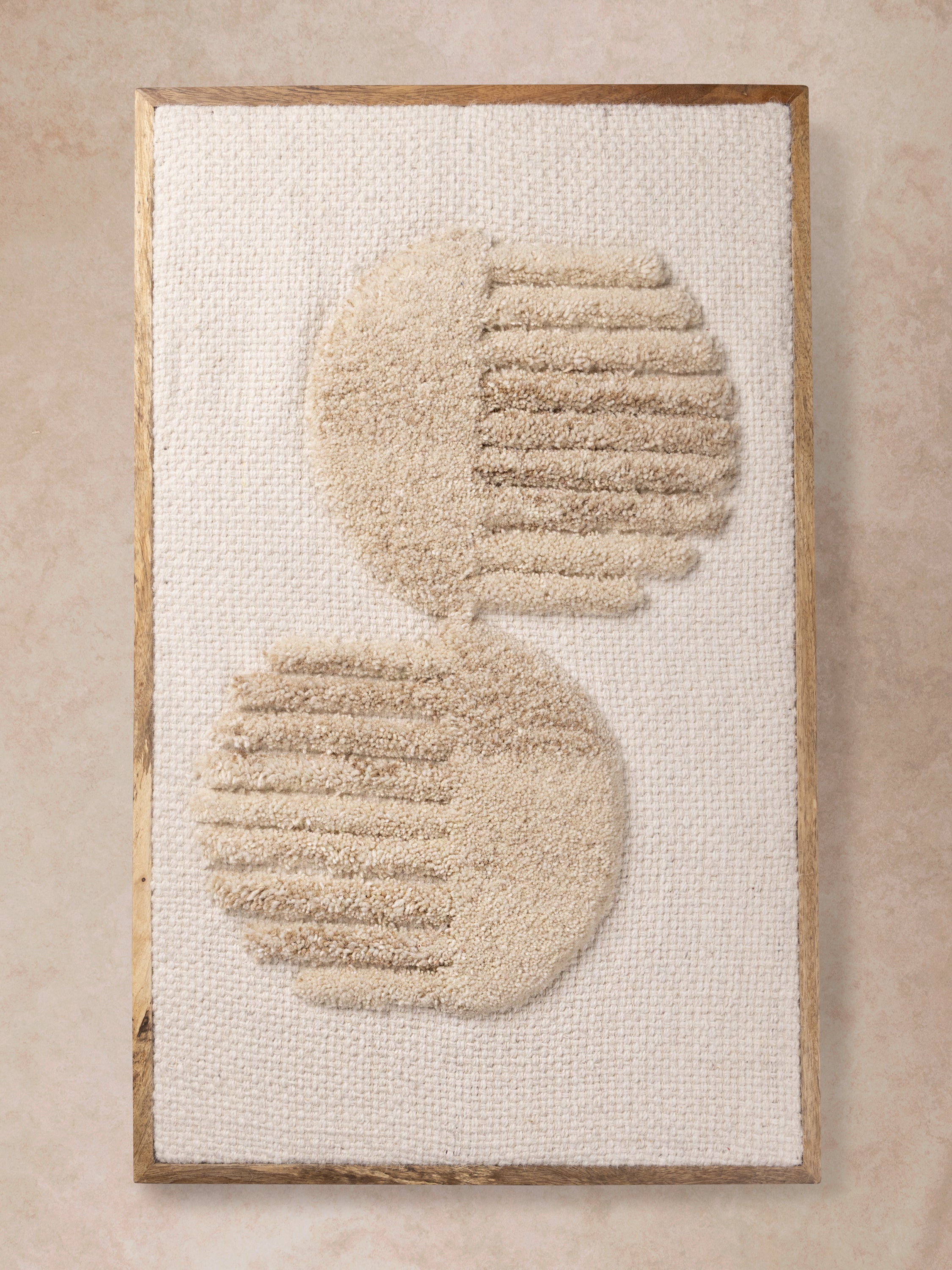 handwoven wool wall art with sculptural circular tufted forms and natural wood frame