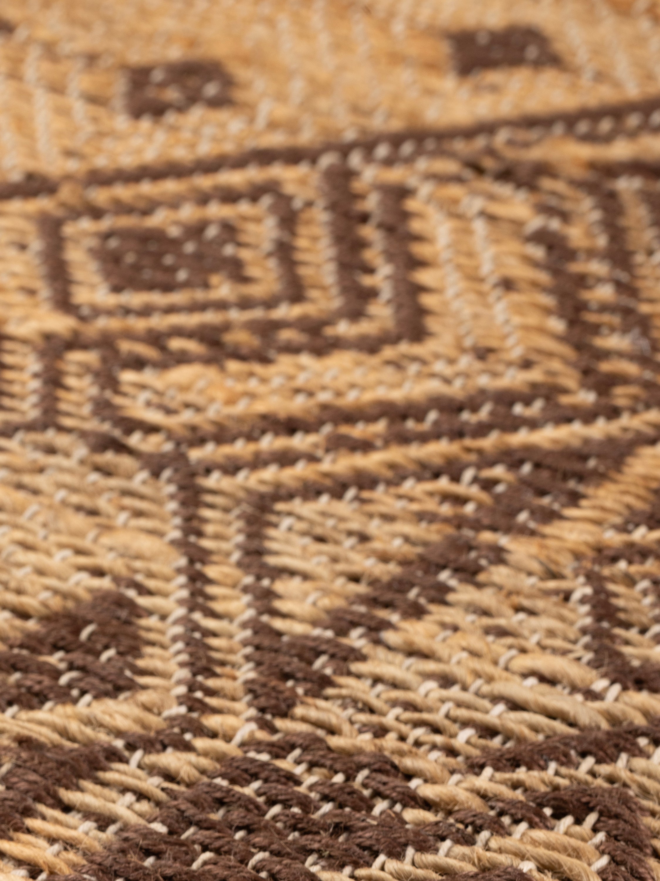 angled view showing dimensional jute weave and handcrafted detail