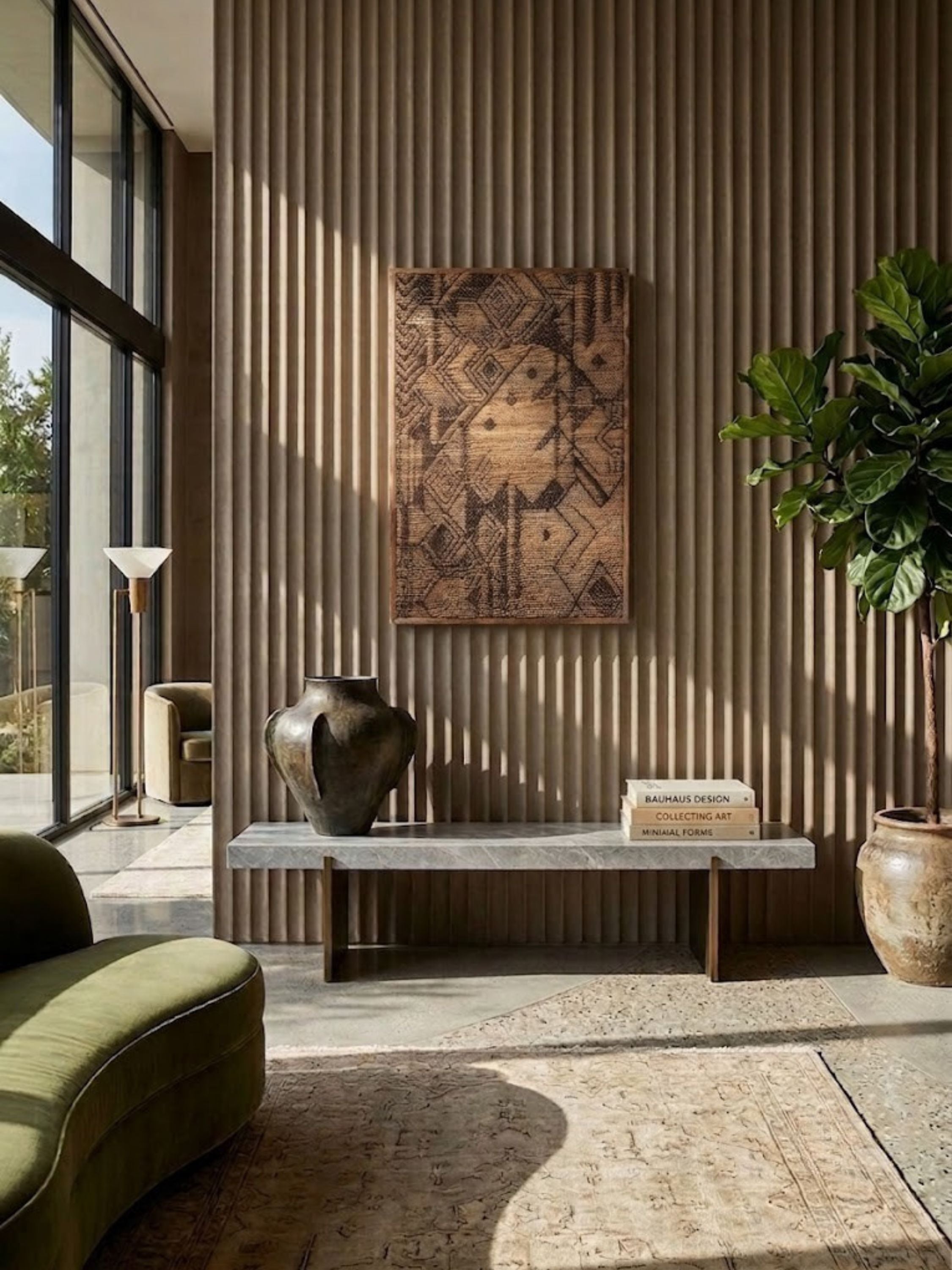Jute wall art with a textured grid weave, styled in a living room.