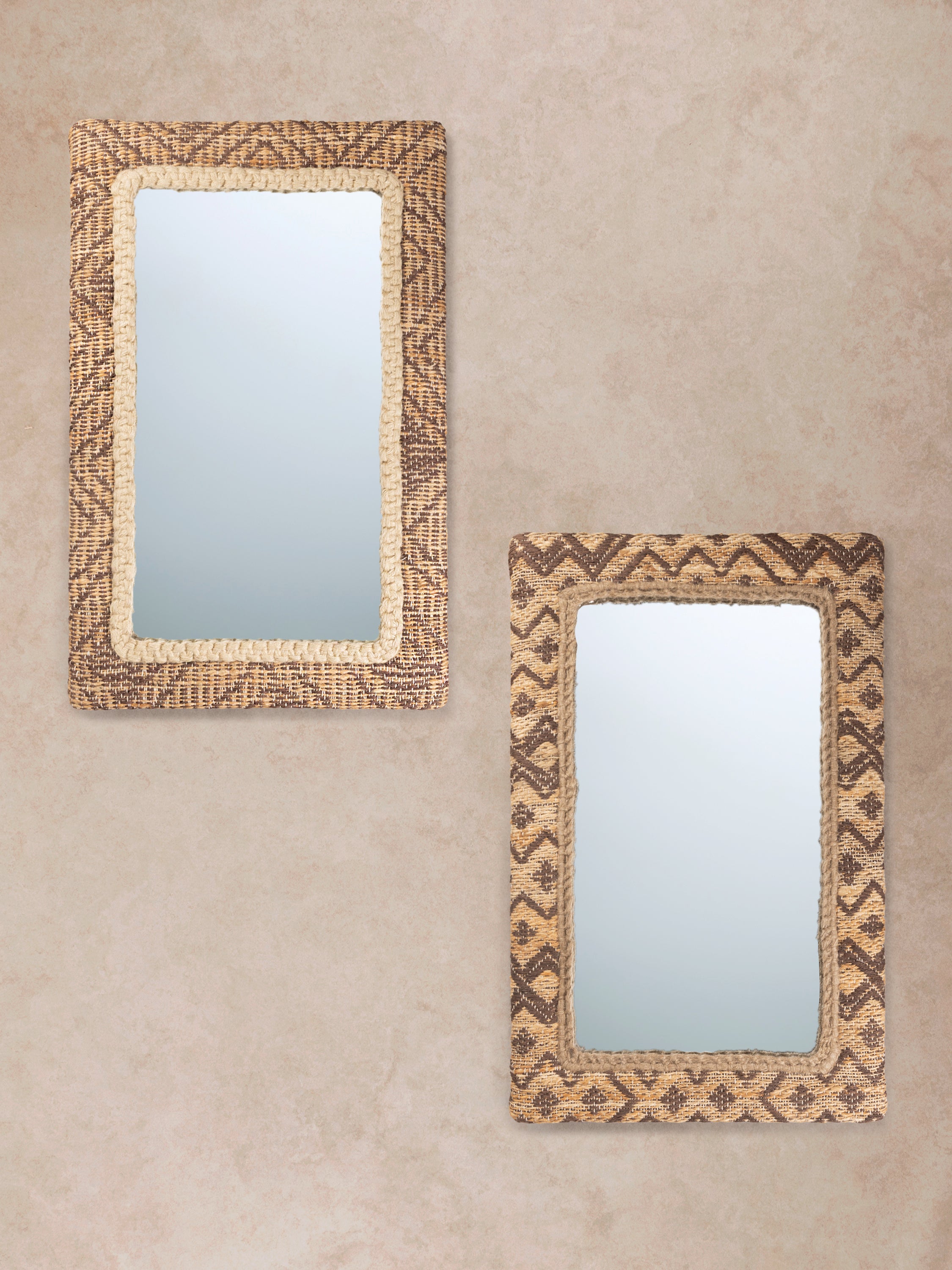 pair of Zulian jute-woven mirrors displayed together on a light wall