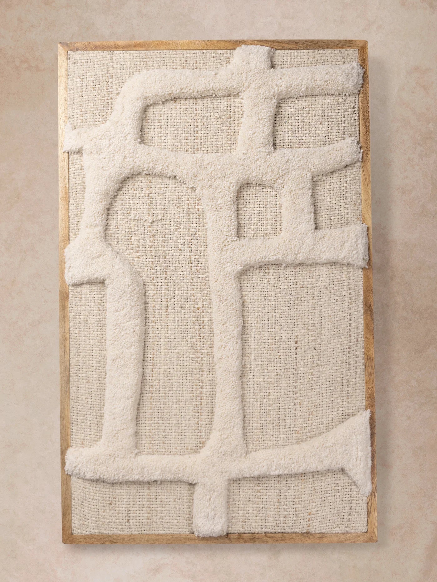 Ivory tufted wall art with abstract linear relief, captured in motion as light moves across the raised surface, revealing texture, depth, and tonal variation