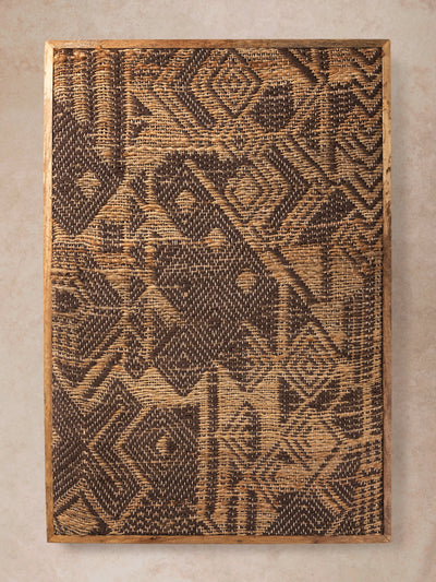 Tufted textile wall art with dense geometric pattern in earthy brown tones shown in motion, with shifting light revealing varied pile height, carved detailing, and surface depth